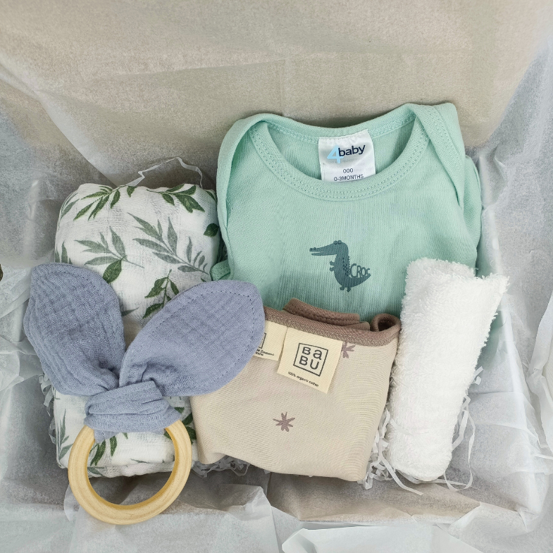 Newborn baby gift box with soft baby wrap, onesie, bib and teething ring